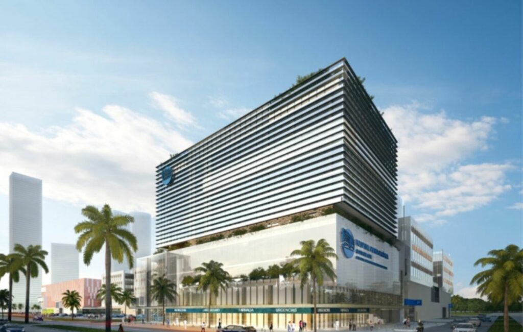 Modern multi-story hospital building with a glass facade and horizontal lines, nestled among palm trees under a clear Panama sky. Ideal for medical tourism, the facility exemplifies advanced healthcare options, weighing pros and cons for international patients seeking quality treatment abroad.