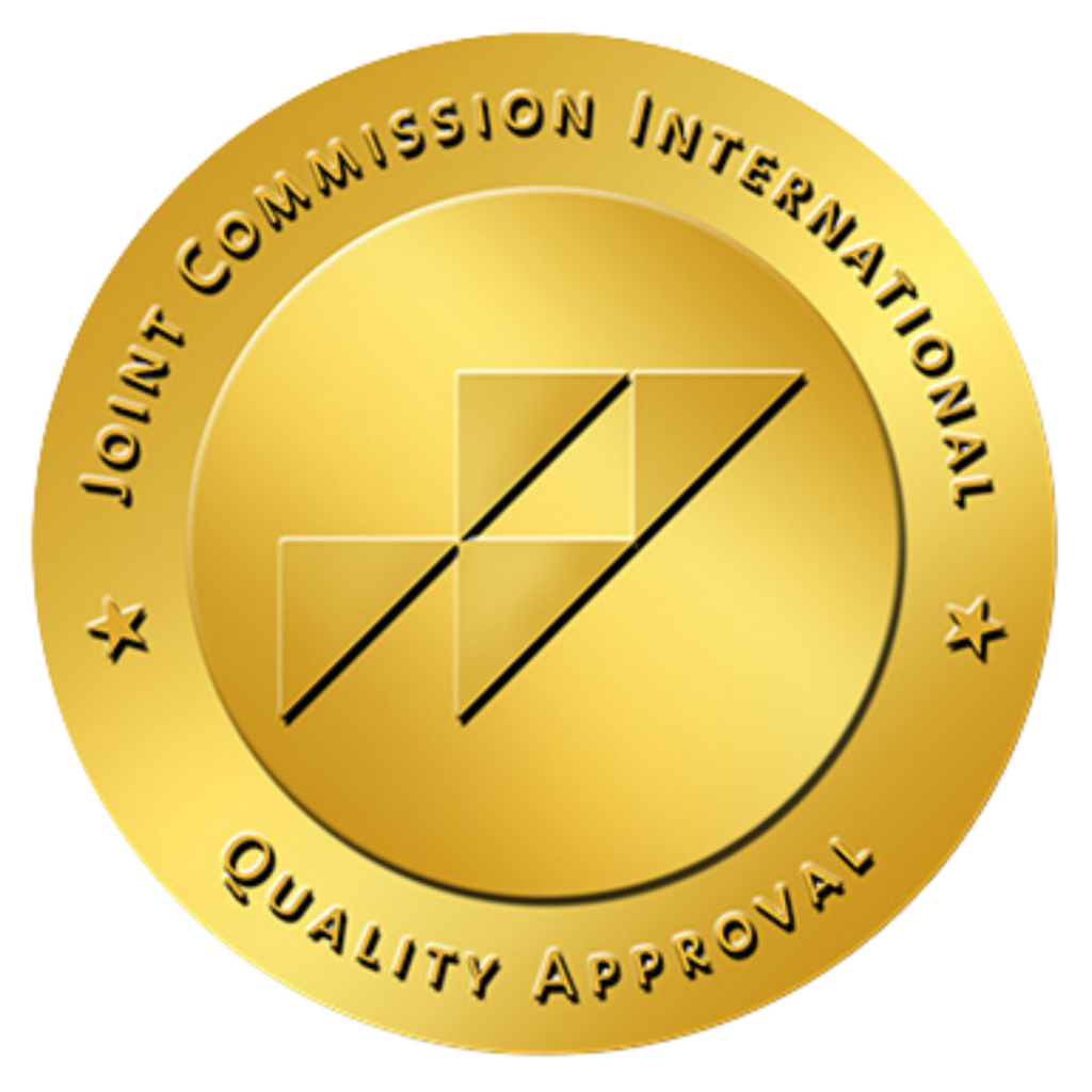 Gold seal of Joint Commission International with the text "Joint Commission International Quality Approval" around a central geometric design, symbolizing excellence and trust in healthcare—a hallmark for top 10 medical tourism destinations.