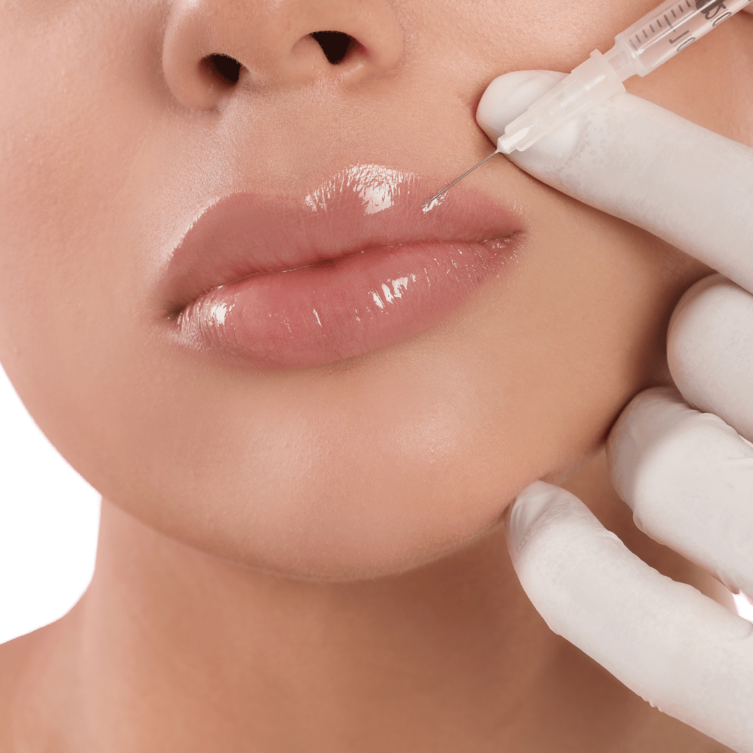 Close-up of a person receiving a lip injection with a syringe. A gloved hand holds the syringe near the lips.