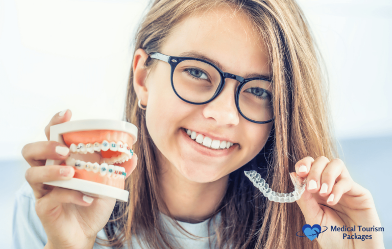 A girl with glasses holds a dental model with braces in one hand and a clear aligner in the other, showcasing Colombia's advanced smile correction methods. She beams with confidence, embodying a comprehensive guide to modern orthodontics.