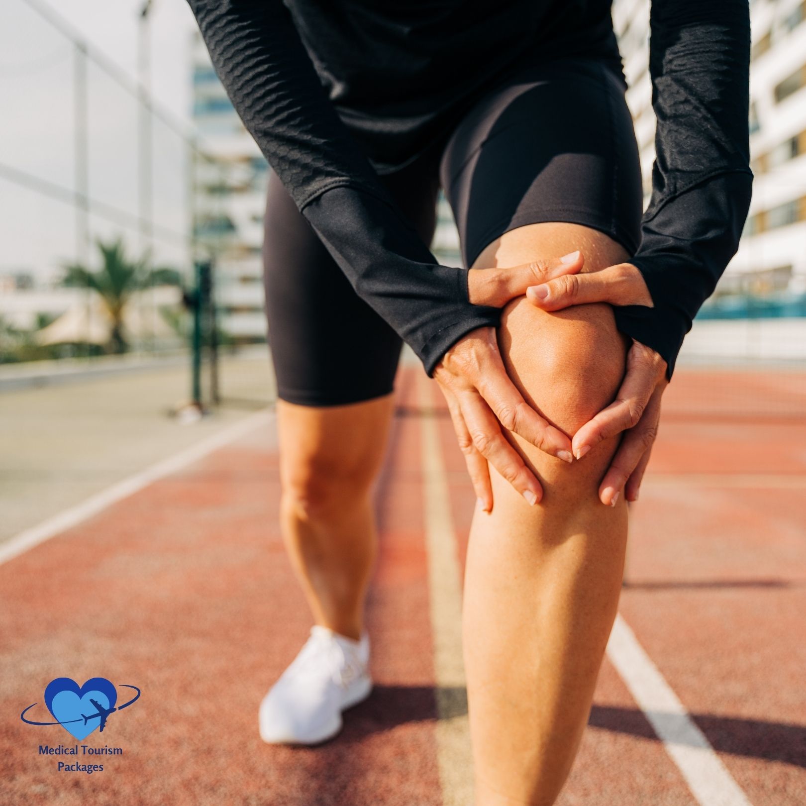 A person, possibly experiencing discomfort or injury, is holding their knee on a sports court. They are wearing athletic clothing and white sneakers, hoping to soon regain mobility and improve their quality of life.